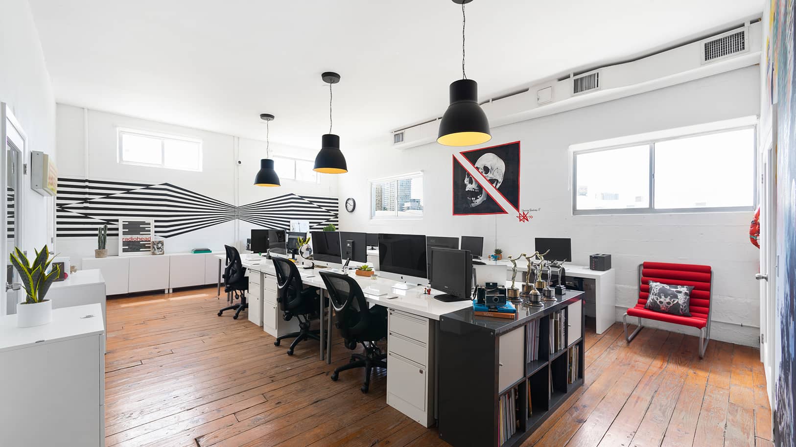 Wide angle view of workstations area at artistic-looking studio office | Think Twice studio